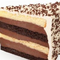 Black & White Fudge Cake Slice · Alternating layers of Buddy’s original vanilla & chocolate cake, filled with our homemade ch...