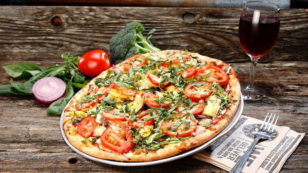 Drag It Thru The Garden · Our garden (basil) is topped with artichokes, basil, broccoli, cheddar, green peppers, mozzarella, mushrooms, red onions, tomatoes, tomato sauce.