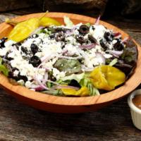 Greek Salad - Family · The Greek Salad is served with red onions, feta, kalamata olives, pepperoncini, heritage mix.