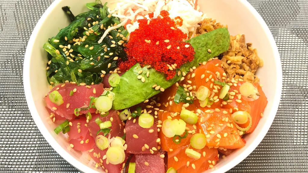 Poke & Poke Bowl · Best seller! Salmon poke, ahi poke, tobiko (fish roe), avocado and green onions. Served with crab salad, seaweed salad, and fried onions over your choice of base.
