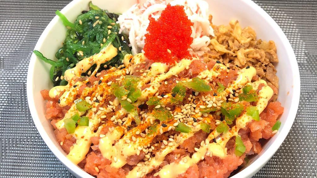 Spicy Tuna Bowl · Gluten-free version available. Spicy tuna, avocado, tobiko (fish roe), jalapeño and chili powder. Served with crab salad, seaweed salad, and fried onions over your choice of base.