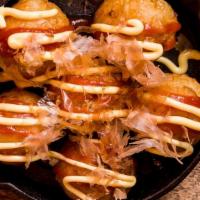 Takoyaki · Deep-fried pancake balls filled with octopus topped with Katsu, mayo sauce and Bonita flakes...