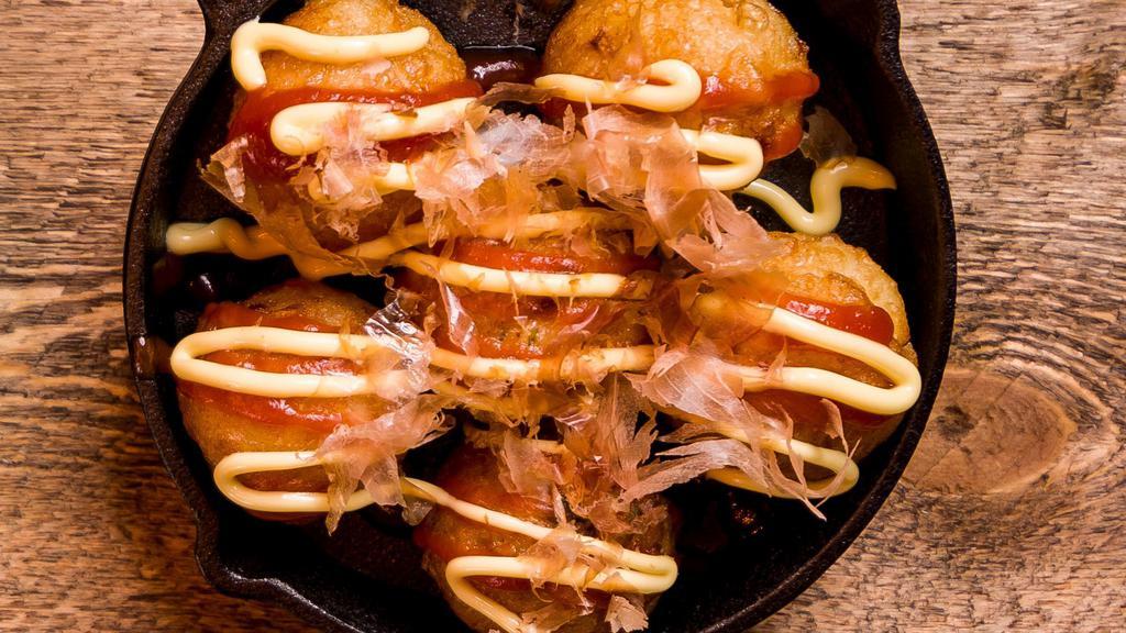 Takoyaki · Deep-fried pancake balls filled with octopus topped with Katsu, mayo sauce and Bonita flakes that go well with fish items.