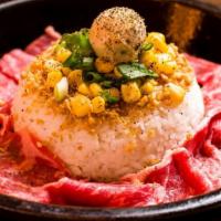Garlic Beef Pepper Rice · Topped with Green Onions, Corn, Garlic Butter and Fried Garlic.