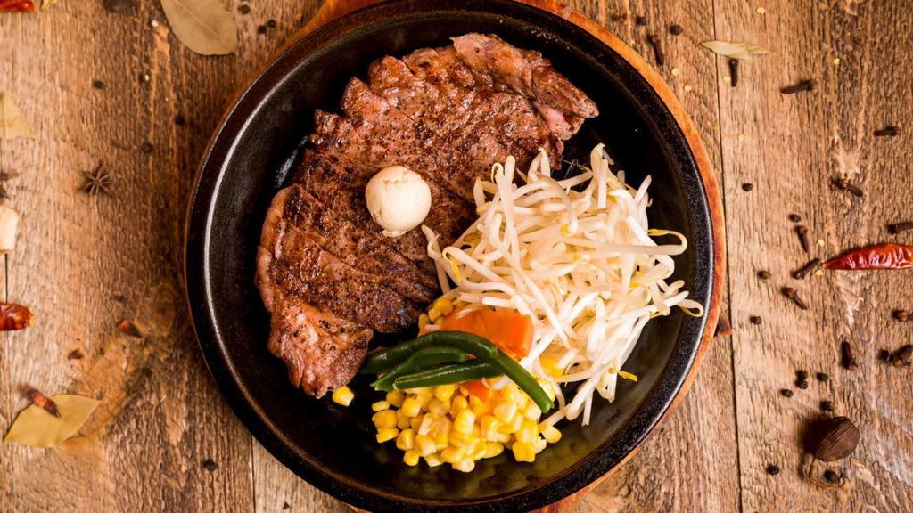 Angus Ribeye Steak · Topped with Carrots, Green Beans, Corn, Bean Sprouts, Garlic Butter.