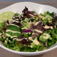 House Salad · Freshly mixed greens with sesame dressing.