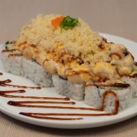 Dynamite Roll · Inside with icrab, avocado, and cucumber.  Outside with baked scallop and mushroom topped wi...