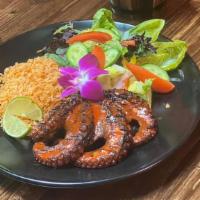 Pulpo zarandeado · w/ Rice & Garden Salad. Grilled octopus w/ nayarita seasonings.