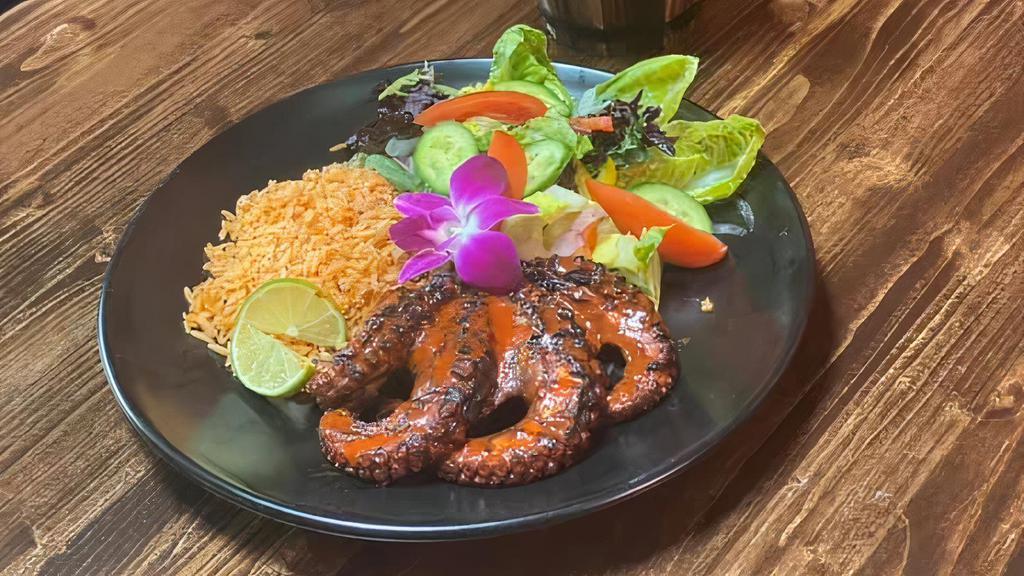 Pulpo zarandeado · w/ Rice & Garden Salad. Grilled octopus w/ nayarita seasonings.