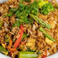 Veggie Fried Rice · Fried rice tossed in a wok with fresh, juicy red peppers, broccoli, asparagus, spring onions...