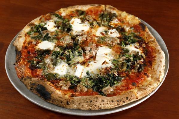 Calabrian Chili Sausage pizza · tomato, mozzarella, broccoli di ciccio, caciocavallo romano