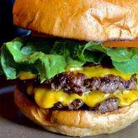 Double Pattie Smash Burger · Pasture raised, organic smash burger. Two patties between a brioche bun and smothered in car...