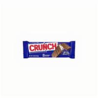 Nestle - Candy - Crunch Bar · A flat square of milk chocolate that has its name “Nestlé Crunch” printed in molded chocolat...