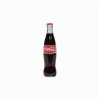 Mexican Coke - 12 Oz Bottle · Made in Mexico; Made with real cane sugar. Retro style Coke glass bottles.