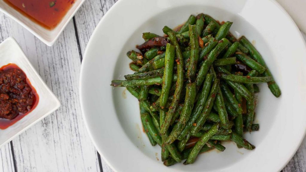 String Beans · Stir fried string beans cooked with garlic, ginger and sweet spicy sauce. Indicate that this item can be made gluten free.