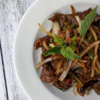 Chili Lamb · Slices of lamb tossed with chili sauce, garlic, onion, basil, jalapenos and chili flakes.