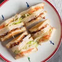 Triple Decker Turkey Club Sandwich · Turkey with bacon, tomatoes, lettuce, and mayo.