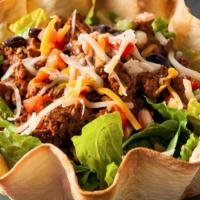 Taco Salad · Lettuce, grilled onions, beans, rice, sour cream, guacamole, cheese, and cilantro. Served wi...