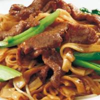 Beef Chow Fun · Slice beef stir fried with vegetable in thick rice noodle.