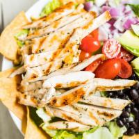 Southwestern Chicken Salad · Romaine, grilled chicken, black beans, cilantro, tortilla strips, pearl tomatoes, corn, red ...