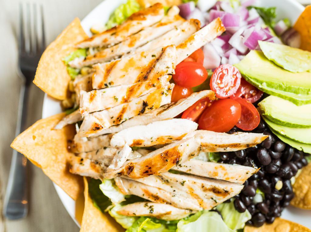 Southwestern Chicken Salad · Romaine, grilled chicken, black beans, cilantro, tortilla strips, pearl tomatoes, corn, red onion, avocado, and ranch dressing.