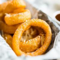 Onion Rings · Topped with parmesan cheese.