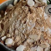 Injeolmi (Soybean Powder) Bingsoo · side with condensed milk, homemade mochi, extra soybean powder and sliced almond.