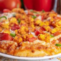 Spicy Paneer Tandoori Vegan Pizza · Indian paneer cheese tossed with mild tandoori spices and a house made tomato sauce, daiya c...