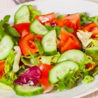 Garden Salad · Cherry tomatoes, carrots, cucumber, and red onions served over a bed of romaine an iceberg l...