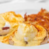 Eggs Benedict · Toasted English muffin topped with Canadian bacon, poached eggs and housemade Hollandaise. S...