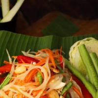 Green Papaya Salad ส้มตำ · Typical Thai Northeastern (I-saan) dish, it is quite interesting that this is the most popul...