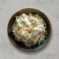 Coleslaw · Aramex coleslaw, shredded cabbage, carrots, fennel seeds, white vinaigrette, mayo, and sugar.
