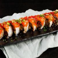 40. Golden Gate Roll · Crab, eel, shrimp tempura topped salmon, tobiko and house sauce.