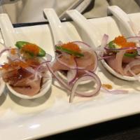 9. Albacore Carpaccio Sashimi (5 Pieces) · Albacore sashimi with jalapeño and onion Japanese sauce.