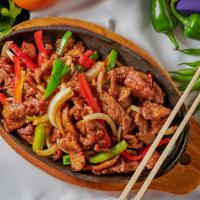 Sizzling Black Pepper Beef · Sliced beef  with onion & bell peppers in black pepper sauce.