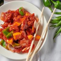 Sweet & Sour Pork · Pork with bell peppers, onions, carrots & pineapples in sweet and sour sauce.