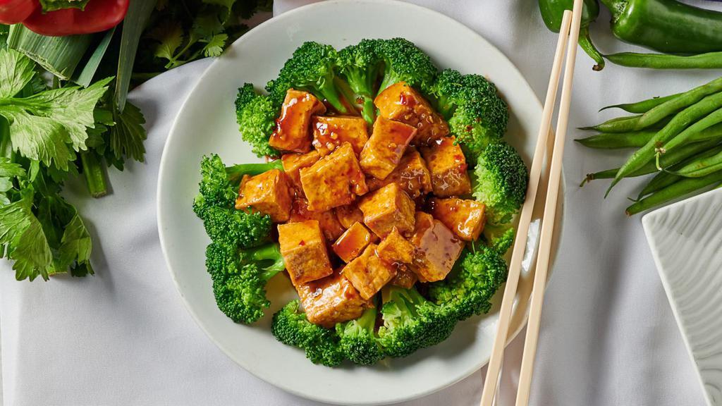 Peking Delight · Hot & spicy. Streamed broccoli & golden brown tofu cubes, slightly coated with a spicy garlic sauce.