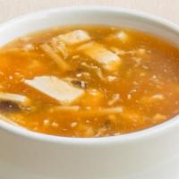 Hot & Sour Soup · Hot & spicy. Shredded sliced mushrooms, tofu, bamboo shoots & egg blossoms in vinegar & pepp...