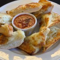 Garlic Cheese Bread · Garlic breads are served with marinara sauce.