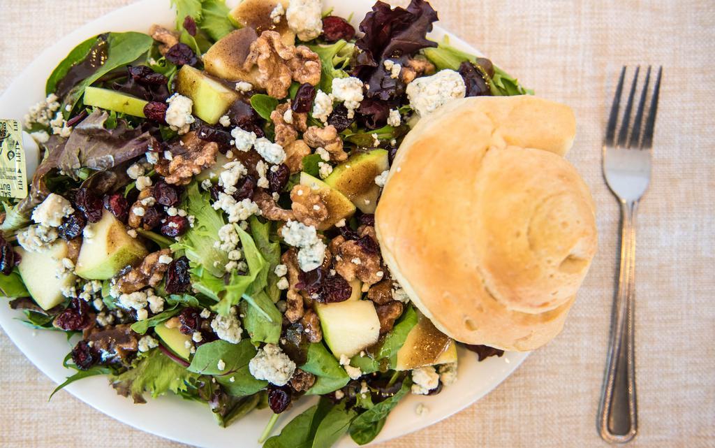 Apple Walnut Salad · Mixed greens tossed with granny Smith apples, sugared walnuts, dried cranberries and balsamic vinaigrette, and topped with bleu cheese crumbles.