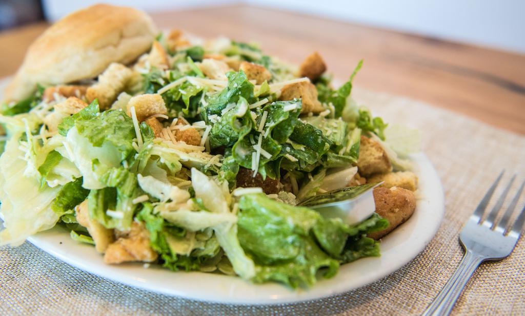 Caesar Salad · Crisp romaine lettuce, Parmesan cheese, croutons, and caesar dressing.