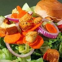 House Salad · Mixed greens, roma tomatoes, cucumbers, red onions, carrots, and croutons.