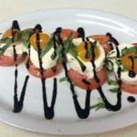Caprese Salad · Roma tomatoes, fresh sliced mazzarella, fresh basil, golden peppadew peppers all topped with...