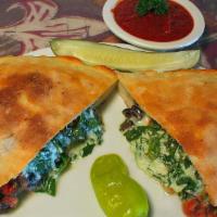 Create-Your-Own Calzone · Start with cheese and sauce, then choose up to four pizza toppings to create your masterpiec...