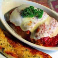 Lasagna · With mushrooms and spinach. Served with garlic bread, and your choice of marinara, Alfredo o...