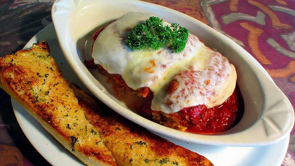 Lasagna · With mushrooms and spinach. Served with garlic bread, and your choice of marinara, Alfredo or pesto sauce.