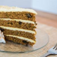 Four High Carrot Cake · Four layers of moist carrot cake filled with raisins, walnuts, and pineapple, topped with a ...