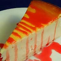 New York Cheesecake · A classic cheesecake blended to a rich and creamy texture, topped with strawberry sauce.