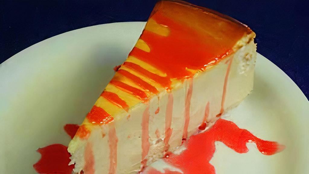 New York Cheesecake · A classic cheesecake blended to a rich and creamy texture, topped with strawberry sauce.