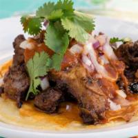 Vampiro · Al pastor (pork), salsa ranchera, red onions, and cilantro on a fried cheese tortilla.